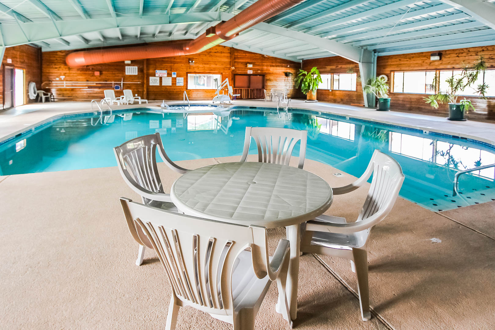 A spacious indoor swimming pool at VRI's Roundhouse Resort in Pinetop, Arizona.